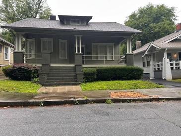 Charming home featuring a covered front porch, providing a welcoming entrance to this beautiful property at 389 Dargan Sw Pl, Atlanta, GA 30310