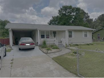 Charming one-story home with a covered carport and a well-maintained front yard at 60 King Blvd, Mcdonough, GA 30253