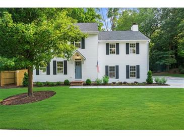 Charming two-story home with black shutters and a well-manicured lawn, showcasing classic curb appeal at 270 Park Bridge Ln, Roswell, GA 30075