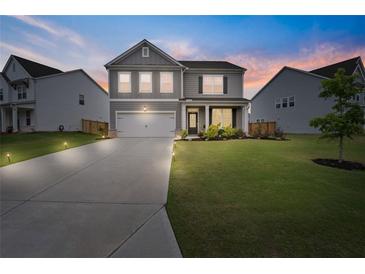 Charming two-story home with a well-manicured lawn and a two-car garage in a great neighborhood at 537 Garnet Dr, Acworth, GA 30101