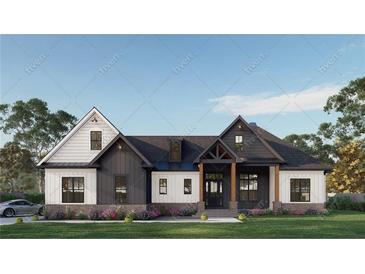 Charming two-story home featuring a symmetrical facade and inviting entrance with landscaped yard at 1779 Granade Sw Rd, Conyers, GA 30094