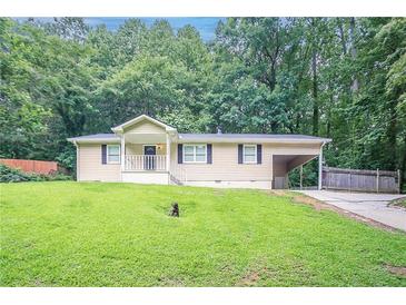 Charming single-story home with a well-maintained lawn and front porch at 220 Harwell Nw Rd, Atlanta, GA 30331
