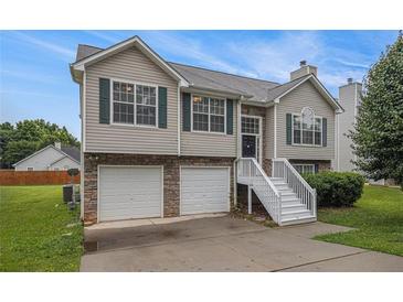 Charming two-story home with a two-car garage and well-maintained landscaping at 1501 Buckingham, Stockbridge, GA 30281