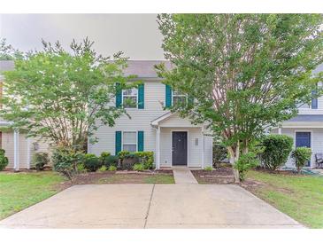 Inviting two-story home with green shutters and a large parking pad at 257 Turnstone Rd, Stockbridge, GA 30281