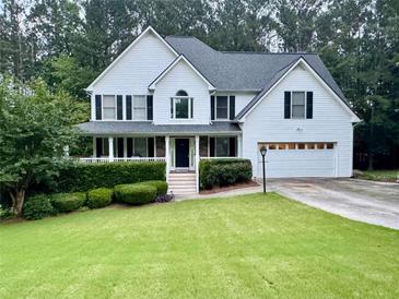 Charming two-story traditional home with a manicured lawn and attached two car garage at 111 Bexley Ln, Douglasville, GA 30134