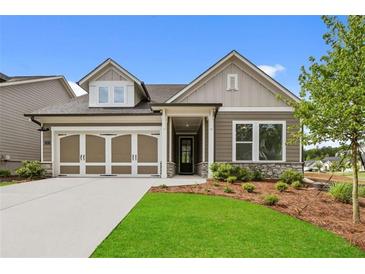 Charming single-Gathering home featuring a well-maintained lawn and a welcoming two-car garage at 2012 Ripple Park Bend, Canton, GA 30114