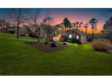 Charming single Gathering home with lush lawn and landscaping situated on a landscaped lot at 46 Centerport Dr, White, GA 30184