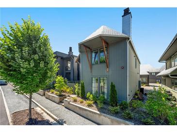 Stylish two-story home with modern design and a well-maintained, landscaped front yard at 260 2Nd St, Fayetteville, GA 30214