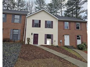 Charming townhome with a two-story facade, neutral siding, and classic shutters at 6002 Pat Mell Se Pl, Smyrna, GA 30080