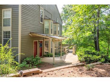 View of the exterior with a covered front porch and well-maintained landscaping at 607 Riverview Se Dr # 607, Marietta, GA 30067