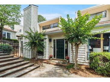 Inviting exterior of a two-story home with a charming front door and well-manicured landscaping at 663 Serramonte Dr, Marietta, GA 30068