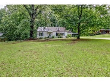 Charming one-story home surrounded by lush greenery, offering a peaceful retreat at 1774 Willis Mill Rd, Atlanta, GA 30311