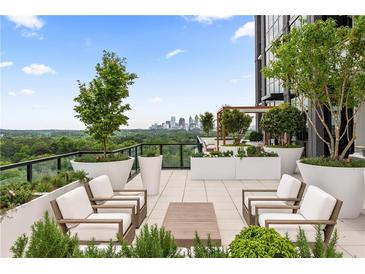 Inviting rooftop terrace with ample seating, lush greenery, and skyline views for relaxing or entertaining guests at 2425 Peachtree Ne Rd # 1503, Atlanta, GA 30305