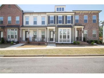Charming townhome with varied facades, inviting entrances, and well-manicured front lawns at 3313 Park Pointe Cir, Scottdale, GA 30079
