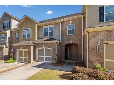 Charming brick townhome with attached garage and covered entryway at 100 Trailside Way, Hiram, GA 30141