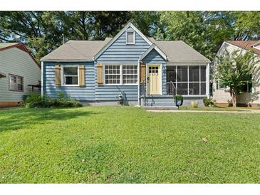 Charming blue home featuring a screened porch and a well-maintained front lawn at 1649 Beecher Sw St, Atlanta, GA 30310