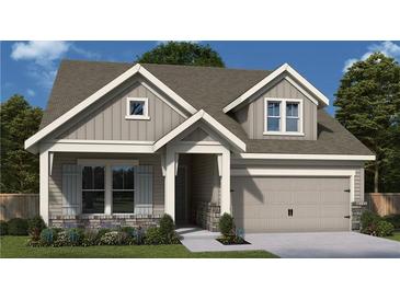 Charming single-story home featuring board and batten siding, stone accents, and an attached two-car garage at 207 Strawberry Lane, Woodstock, GA 30189