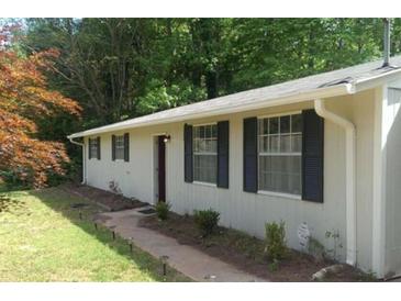Charming single-story home featuring a well-maintained lawn and classic curb appeal at 4363 Stonewall Tell Rd, Atlanta, GA 30349