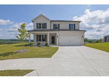 Beautiful two-story home with a brick exterior, large windows, and a well-manicured front lawn at 3455 Jasmine Sw Way, Atlanta, GA 30331