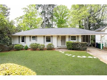 Charming one-story home with a well-manicured lawn, fresh landscaping and a painted brick exterior at 1295 Lindenwood Ne Ln, Brookhaven, GA 30319