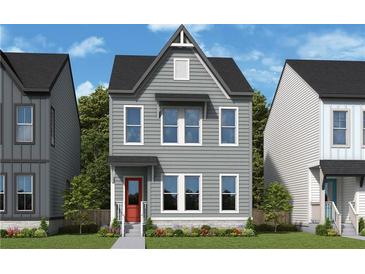 Charming two-story home with gray siding, bright red door, and well-maintained landscaping at 752 Auguste Ave, Decatur, GA 30033