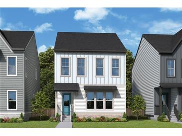 Charming two-story home with vertical siding and a welcoming teal-colored front door at 754 Auguste Ave, Decatur, GA 30033