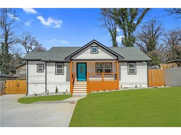 Charming renovated home featuring a welcoming front porch and fresh landscaping at 3470 Glenwood Rd, Decatur, GA 30032