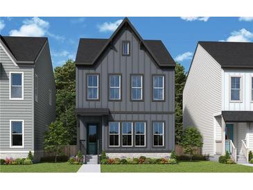 Charming two-story home with vertical siding, a modern roofline, and professionally landscaped front yard at 790 Timbre Ln, Decatur, GA 30033