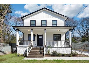 Charming two-story home with a covered porch and black trim accents, perfect for curb appeal at 912 Ira Sw St, Atlanta, GA 30310