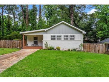 Charming single-story home with a well-maintained lawn, freshly painted exterior, and a welcoming front porch at 1564 Belva Ave, Decatur, GA 30032