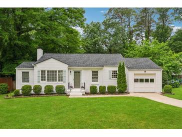 Charming single-story home with a well-manicured lawn and beautiful landscaping at 1383 Fenway Cir, Decatur, GA 30030