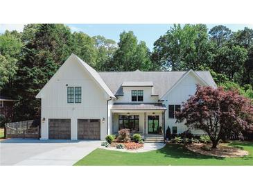 Stunning two-story modern farmhouse with a two-car garage and beautifully landscaped front yard at 2756 Octavia Ln, Marietta, GA 30062