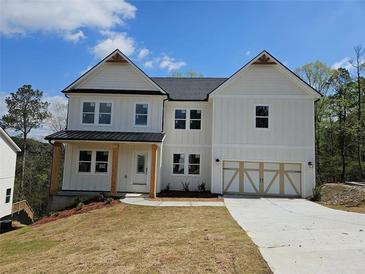 Inviting two-story home featuring a two-car garage and covered entryway at 195 Silvercrest Dr, Acworth, GA 30101
