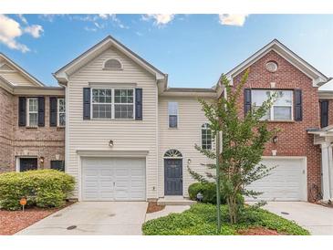 Charming townhome with a one-car garage, blue shutters, neutral siding, and manicured landscaping at 768 Nehemiah Sw Ln, Atlanta, GA 30331
