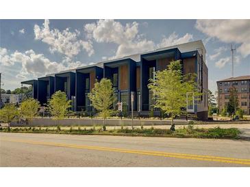 Modern townhome complex with striking dark blue exteriors and contemporary design elements at 816 Berne St # 6, Atlanta, GA 30316