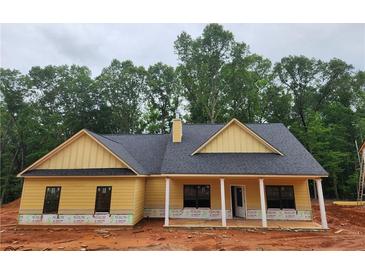 Inviting single-story home featuring a covered front porch and classic architectural details at 92 Jeffrey Ln, Dallas, GA 30157