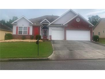 Charming single-story home featuring a well-manicured lawn, red shutters, and an attached two-car garage at , Atlanta, GA 30331