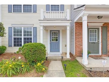 Charming two-story home with inviting blue front door and well-maintained landscaping at 2754 Terrell Trace Dr, Marietta, GA 30067