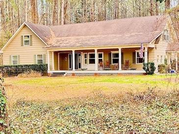 Charming single Gathering home featuring a large front porch and a well-maintained lawn at 230 White Rd, Fayetteville, GA 30214