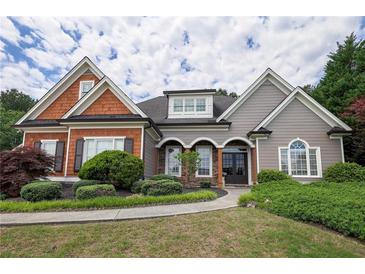 Charming two-story home with manicured landscaping and a welcoming front entrance at 1997 Shaker Falls Ln, Lawrenceville, GA 30045