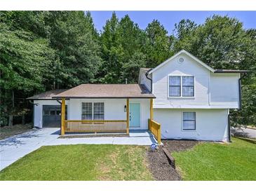 Charming two story home featuring a freshly painted exterior, attached garage and cozy porch at 259 Tarragon Sw Way, Atlanta, GA 30331