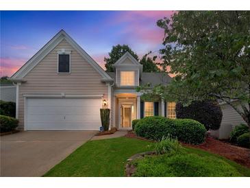 Charming single-Gathering home with attached garage and a well-maintained front yard at sunset at 1335 Seneca, Cumming, GA 30041
