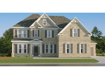 Traditional brick home with manicured lawn and welcoming front door, inviting curb appeal at 252 Deer Valley Run, Canton, GA 30115