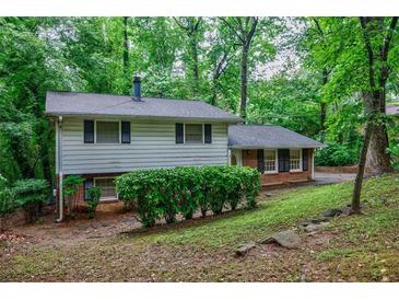 Charming split-level home with lush greenery and well-maintained landscaping at 3294 Francine Dr, Decatur, GA 30033