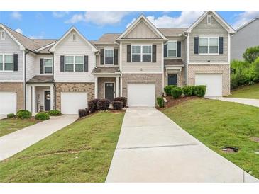 Charming townhomes with manicured lawns and individual driveways, providing curb appeal and convenience at 5668 Union Pointe Dr, Union City, GA 30291