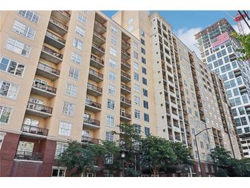 A multi-story condo building featuring multiple balconies and a red brick facade on the lower level at 1101 Juniper Ne St # 1012, Atlanta, GA 30309