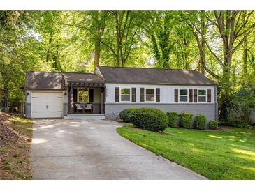Charming single-story home with well-maintained lawn and inviting curb appeal at 1002 Forrest Blvd, Decatur, GA 30030