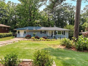Charming single-story home featuring a well-maintained front yard and inviting curb appeal at 553 Collingwood Dr, Decatur, GA 30032
