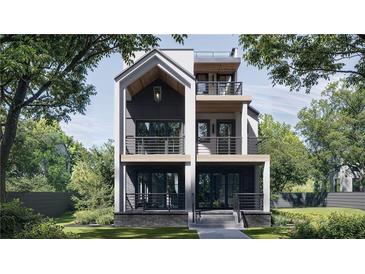 Stunning three-story home featuring a modern design, multiple balconies, and professional landscaping at 339 Peachtree Ne Ave, Atlanta, GA 30305