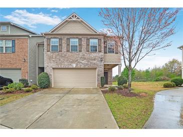 Charming two-story home with brick accents, a two-car garage, and well-maintained landscaping at 2528 Morgan Chase Dr, Buford, GA 30519